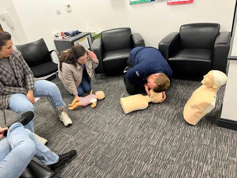 Trainee checking pulse on mannequin